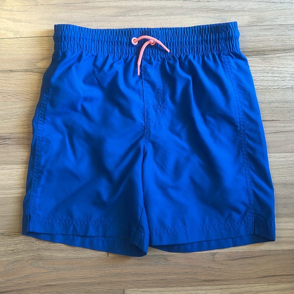 Old Navy royal blue swim trunks with coral drawstring. size 10/12